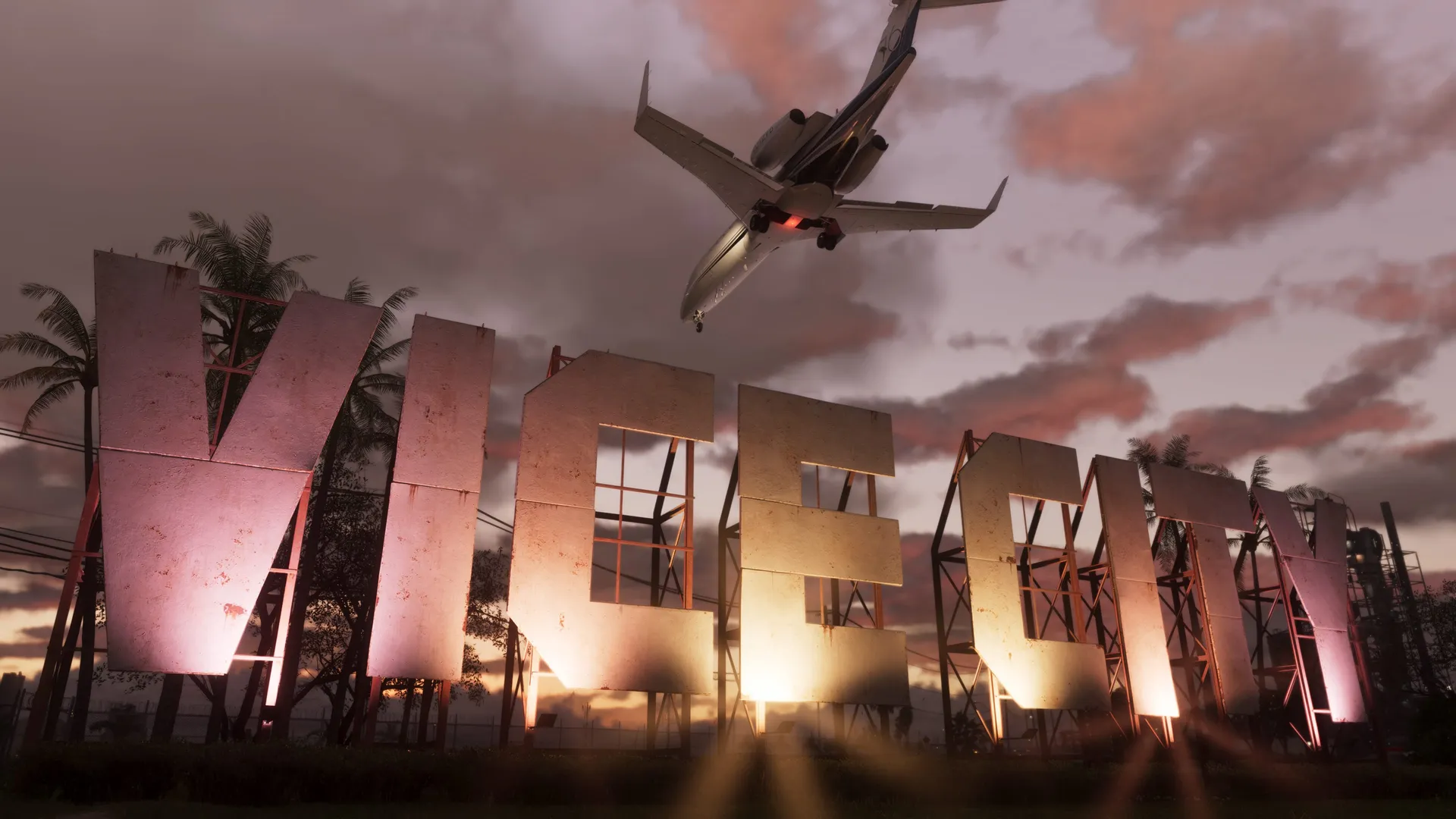 An airplane above the Vice City sign and palm trees at sunset in an official GTA VI screenshot
